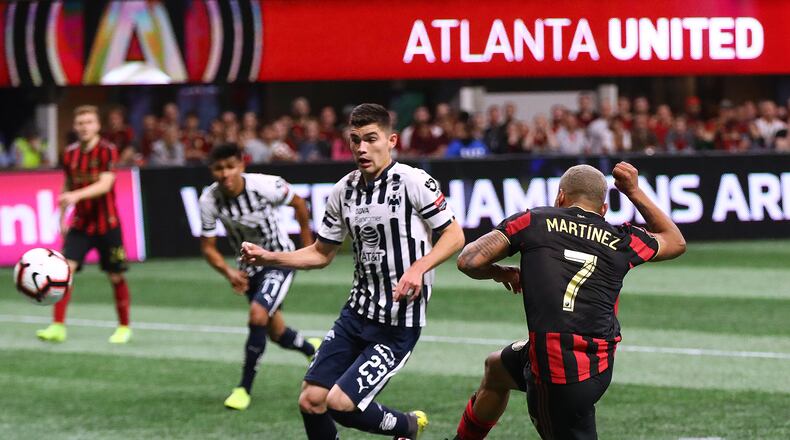 Atlanta United forward Josef Martinez scores a goal past Monterrey defender Johan Vasquex for a 1-0 lead during the second half in a Concacaf Champions league quarterfinal match on Wednesday, March 13, 2019, in Atlanta. Atlanta United won the match 1-0 but failed to advance.   Curtis Compton/ccompton@ajc.com