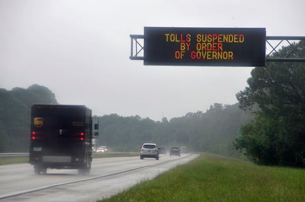 As Hurrcane Irma approaches Florida September 8, 2017 a sign on a toll road leading from Cocoa Beach to Orlando alerts drivers that tolls have been suspended because of the impending storm.  Warning that Irma would be worse than Hurricane Andrew, which killed 65 people in 1992, Florida's governor said all of the state's 20.6 million inhabitants should prepare to evacuate.  (BRUCE WEAVER/AFP/Getty Images)