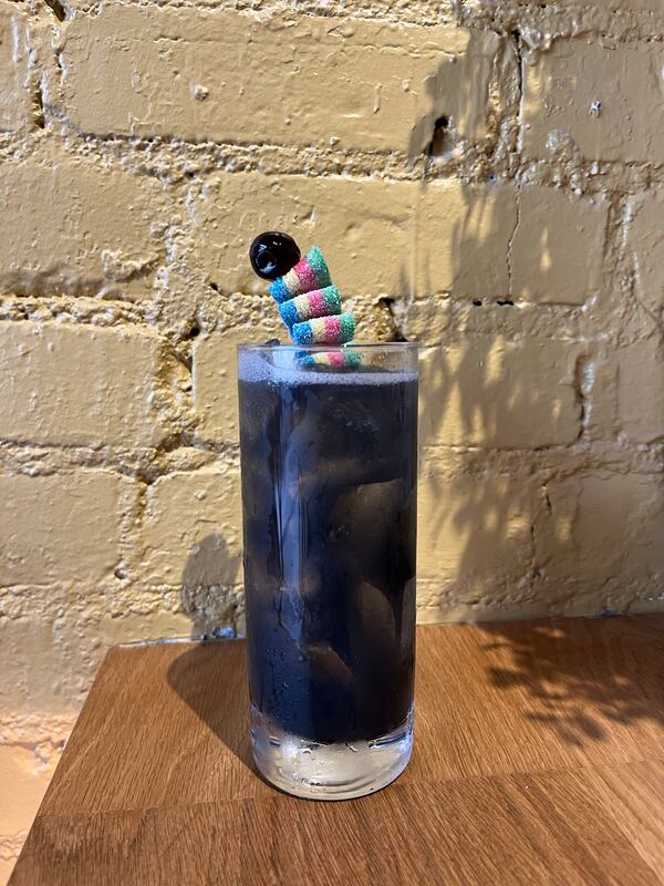 Marcus Bar & Grille's the Candyman drinks like an homage to trick-or-treat candies, with a delightful mix of sweet and sour flavors and a sour strip candy garnish. 
(Courtesy of Marcus Bar & Grille)