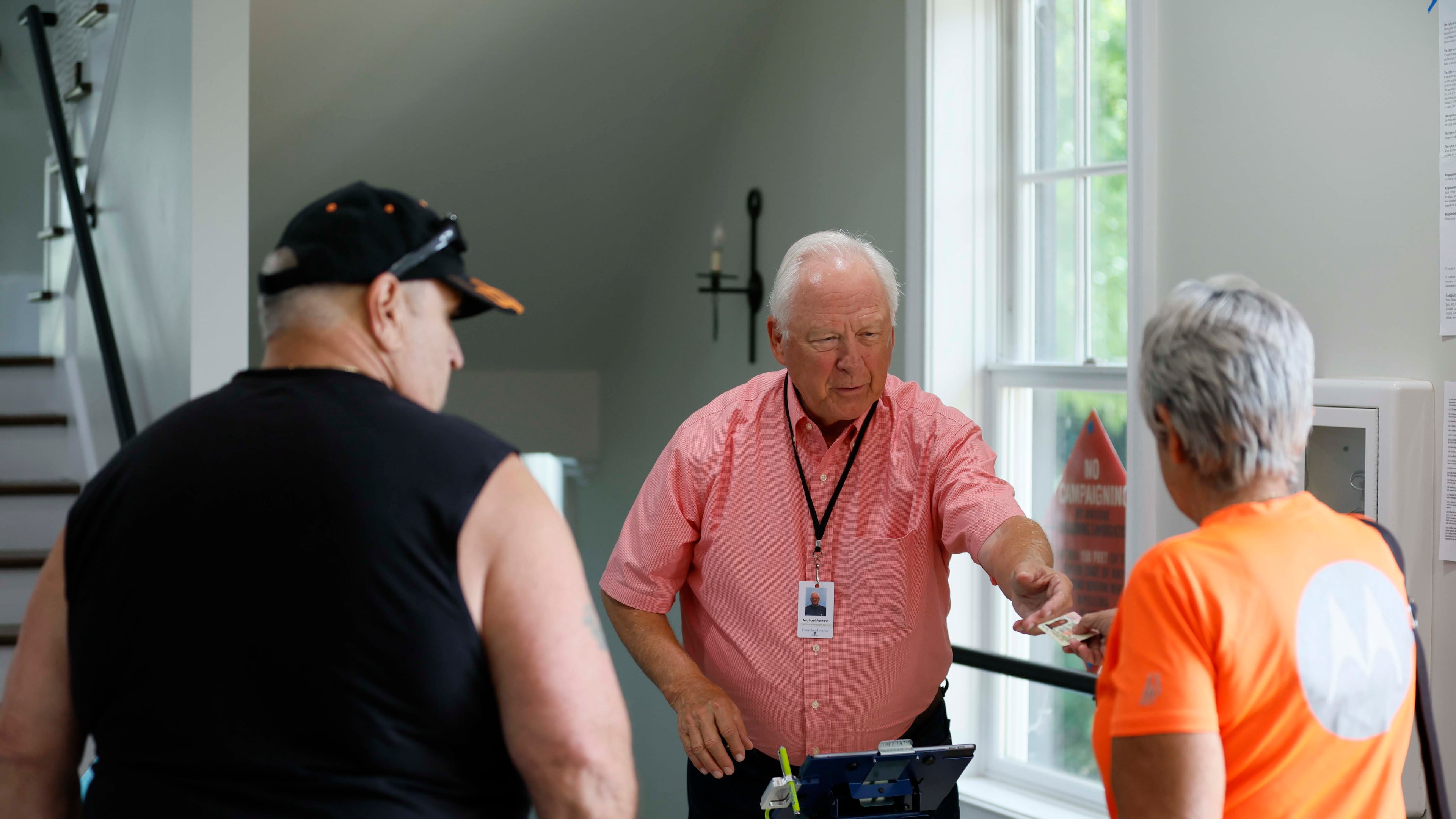 Michael Parnow, a poll manager at Canton City Hall, assists voters at the Riverr-Green subdivision in Canton during the special election for the state senate seat in Cherokee on Tuesday, August 26,2025, to complete the term of former state Sen. Brandon Beach, which runs through January 2027.
(Miguel Martinez/ AJC)