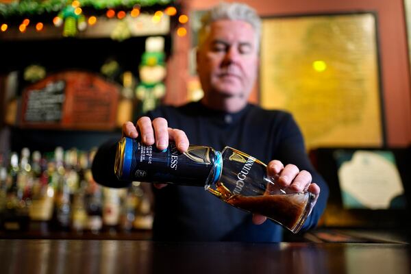 Tommy McCarthy, owner of the Burren Pub, pours a non-alcohol Guinness 0, Wednesday, March 12, 2025, in Somerville, Mass. (AP Photo/Robert F. Bukaty)