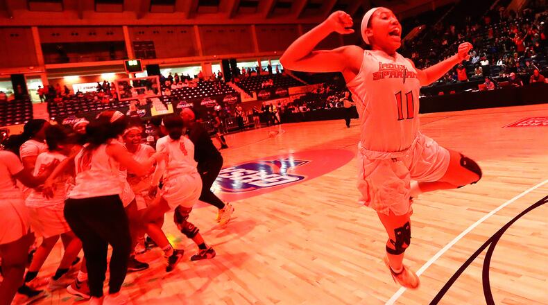 Greater Atlanta Christian star Ava Irvin leaps in the air as the lights turn red when time expires in a 54-44 victory over Beach to win the Class 3A state basketball championship Thursday, March 5, 2020, in Macon. (Curtis Compton ccompton@ajc.com)