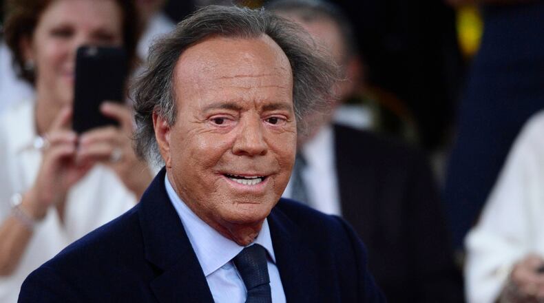 FILE - Spanish singer Julio Iglesias smiles during his star unveiling ceremony at the Walk of Fame in San Juan, Puerto Rico, Thursday, Sept. 29, 2016. (AP Photo/Carlos Giusti, file)