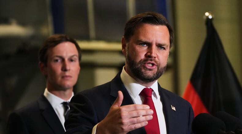 U.S. Vice President JD Vance speak to the media as Jared Kushner looks on, in Kiryat Gat, Israel, Tuesday, Oct. 21, 2025. (AP Photo/Francisco Seco)