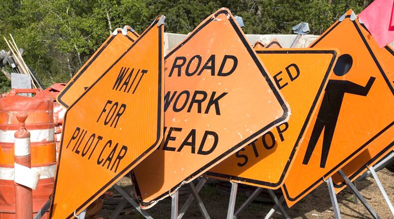 State highway crews this week will be replacing reflective lane markers along Ga. 20 in Cherokee County. AJC FILE