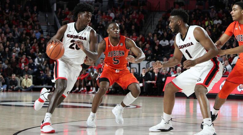 Georgia forward Rayshaun Hammonds (20) and teammate Yante Maten (1) in action against Auburn at Stegeman Coliseum in Athens, Ga., on Saturday, Feb. 10, 2018. (Photo by Nicole Adamson/UGA)
