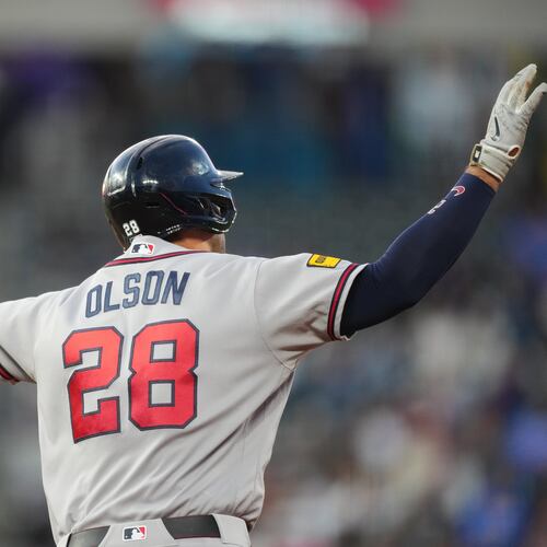 Atlanta Braves' Matt Olson gestures to the bullpen as he circles the bases after hitting a solo home run off Colorado Rockies starting pitcher Jose Quintana in the fourth inning of a baseball game Friday, May 1, 2026, in Denver. (AP Photo/David Zalubowski)