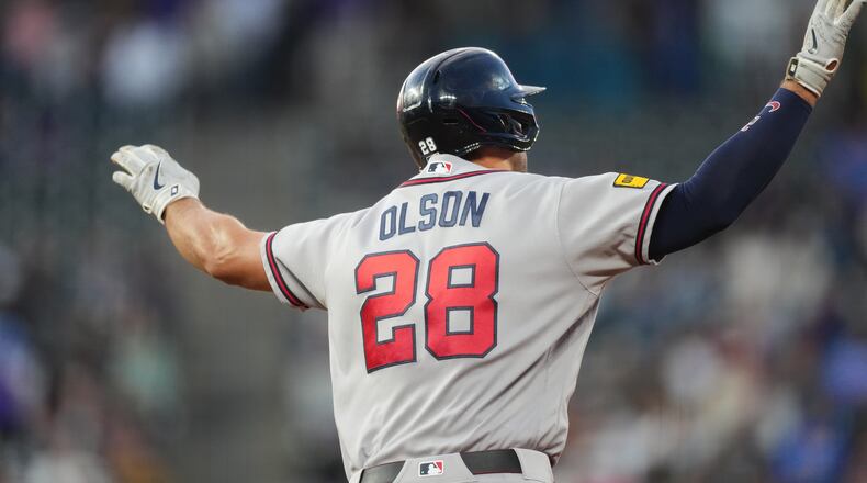 Atlanta Braves' Matt Olson gestures to the bullpen as he circles the bases after hitting a solo home run off Colorado Rockies starting pitcher Jose Quintana in the fourth inning of a baseball game Friday, May 1, 2026, in Denver. (AP Photo/David Zalubowski)