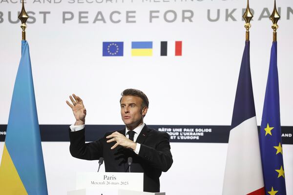 French President Emmanuel Macron speaks during a joint press conference with Ukrainian President Volodymyr Zelenskyy following a bilateral meeting at the Elysee Palace in Paris, Wednesday, March 26, 2025. (Yoan Valat, Pool via AP)