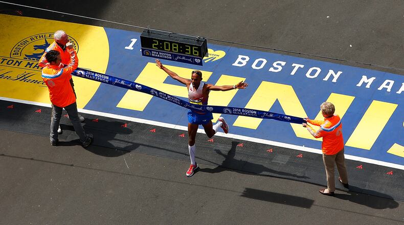 Meb Keflezighi of the United States crosses the finish line in first place to win the 2014 B.A.A. Boston Marathon on April 21, 2014 in Boston, Massachusetts.