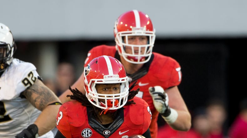 Georgia running back Todd Gurley (3) breaks through the Vanderbilt line in the second half of an NCAA college football game Saturday, Oct. 4, 2014, in Athens, Ga.. Georgia won 44-17. (AP Photo/John Bazemore) Todd Gurley has been one of the nation's top Heisman candidates all season. (AP photo)