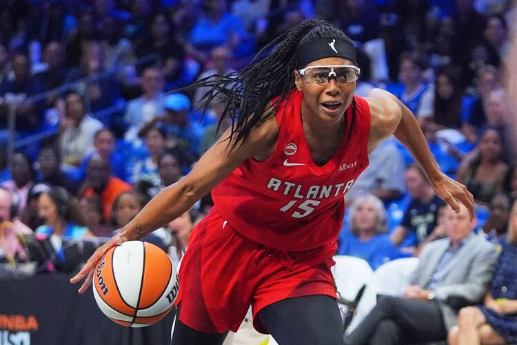 Atlanta Dream guard Allisha Gray (15) drives during the second half of a WNBA basketball game against the Dallas Wings in Arlington, Texas, Wednesday, July 29, 2026. (AP Photo/LM Otero)