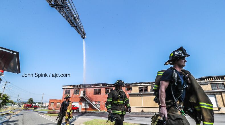 Fire crews have been working to contain the fire at DHM Adhesives Inc. since early Friday morning. When they arrived, much of the brick building was in flames.