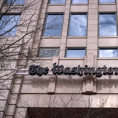 A sign for the Washington Post is seen at the company's offices, Monday, Jan. 26, 2026, in Washington. (AP Photo/Mark Schiefelbein)