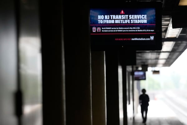An electronic display advises commuters of NJ Transit service disruptions at the Secaucus Junction station in Secaucus, N.J., Wednesday, May 14, 2025. (AP Photo/Seth Wenig)