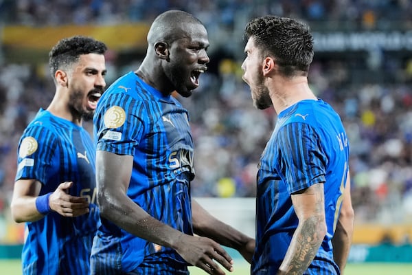 Al Hilal's Kalidou Koulibaly, centre, celebrates with teammates after scoring his team's third goal during the Club World Cup round of 16 soccer match between Manchester City and Al Hilal in Orlando, Fla., Monday, June 30, 2025. (AP Photo/John Raoux)