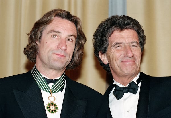 FILE - American actor Robert De Niro, left, appears with French Minister of Culture, Jack Lang, after receiving the French Medal of Art and Letters during the 44th Cannes Film Festival in Southern France on May 17, 1991. (AP Photo/Jose Goitia, File)