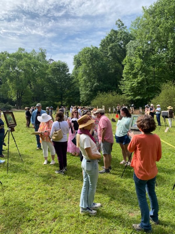 A scene from a past Olmsted Plein Air Invitational PaintQuick event held in Deepdene Park, part of Olmsted Linear Park in the Druid Hills neighborhood. (Courtesy of Olmsted Arts Inc.)