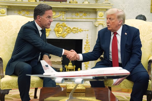 President Donald Trump, right, shakes the hand of NATO Secretary General Mark Rutte during a meeting in the Oval Office of the White House, Monday, July 14, 2025, in Washington. (AP Photo/Evan Vucci)