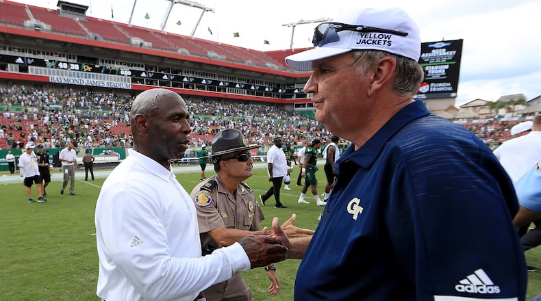TAMPA, FL - SEPTEMBER 08:  Head coach Charlie Strong of the South Florida Bulls  and head coach Paul Johnson of the Georgia Tech Yellow Jackets  shake hands following a game  at Raymond James Stadium on September 8, 2018 in Tampa, Florida.  (Photo by Mike Ehrmann/Getty Images)