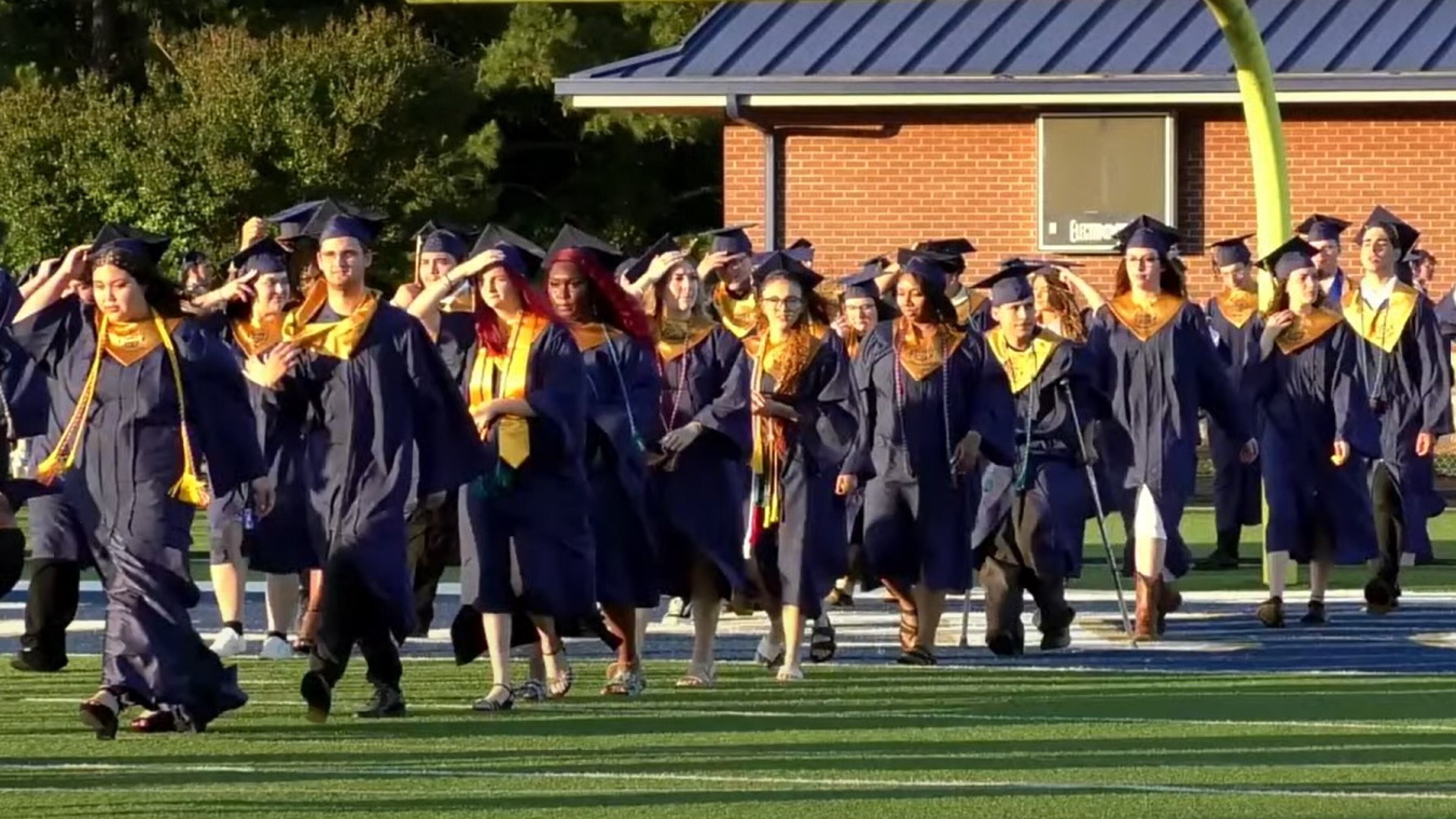 Apalachee High students walk across the football field at the school's commencement ceremony on May 22, 2025. (Photo courtesy Barrow County Schools)