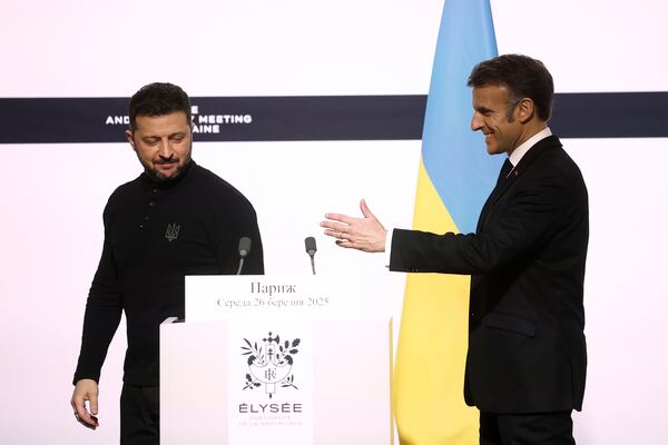 Ukrainian President Volodymyr Zelenskyy, left, and French President Emmanuel Macron leave a joint press conference following their bilateral meeting at the Elysee Palace in Paris, Wednesday, March 26, 2025. (Yoan Valat, Pool via AP)