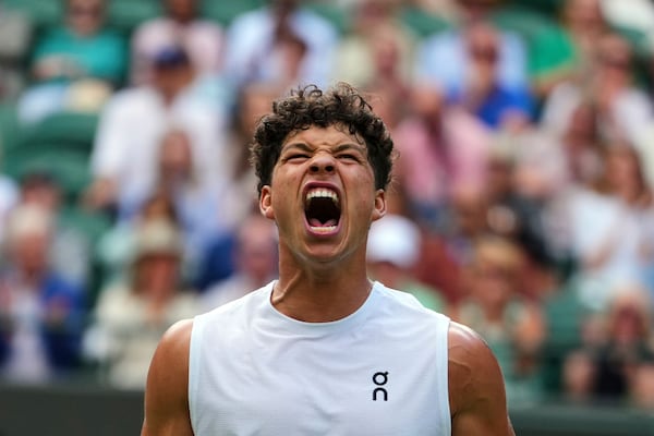 Ben Shelton roars during his fourth-round Wimbledon win.