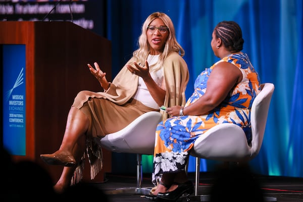 Serena Williams (left) speaks with Carla Thompson Payton during the Mission Investors Exchange 2026 National Conference on Monday, April 27, 2026, in Atlanta. Though Williams has hung up her tennis racket, the sports legend is still taking big swings as an investor. (Jason Getz/AJC)