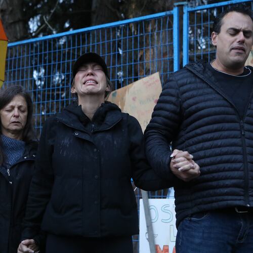 Katie Pasitney, the daughter of one of the co-owners of Universal Ostrich Farms, participates in a group prayer in Edgewood, B.C., following the announcement that the Supreme Court of Canada dismissed the farm's appeal to stay an order to cull more than 300 of its ostriches on Thursday, Nov. 6, 2025. (Aaron Hemens /The Canadian Press via AP)
