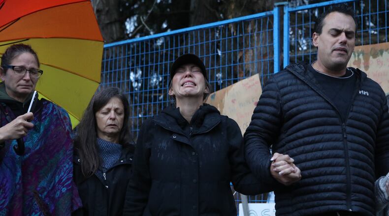 Katie Pasitney, the daughter of one of the co-owners of Universal Ostrich Farms, participates in a group prayer in Edgewood, B.C., following the announcement that the Supreme Court of Canada dismissed the farm's appeal to stay an order to cull more than 300 of its ostriches on Thursday, Nov. 6, 2025. (Aaron Hemens /The Canadian Press via AP)