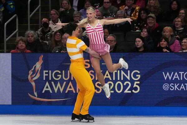 Piper Gilles and Paul Poirier, of Canada, perform during the ice dance rhythm dance program at the figure skating world championships, Friday, March 28, 2025, in Boston. (AP Photo/Charles Krupa)
