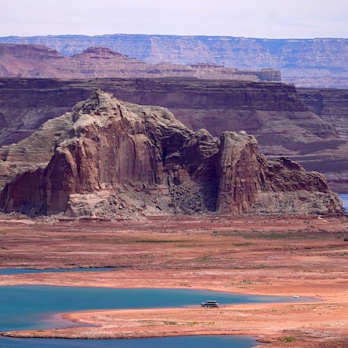FILE - Low water levels at Wahweap Bay at Lake Powell, along the Upper Colorado River Basin are shown, June 9, 2021, at the Utah and Arizona border at Wahweap, Ariz. (AP Photo/Ross D. Franklin, File)