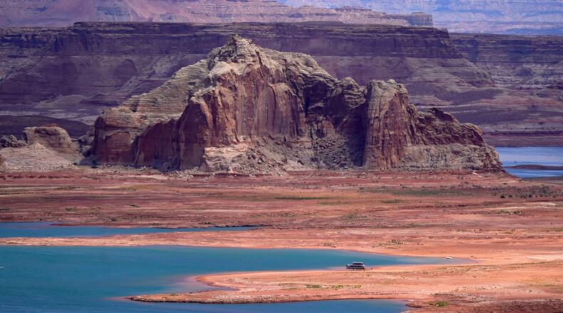 FILE - Low water levels at Wahweap Bay at Lake Powell, along the Upper Colorado River Basin are shown, June 9, 2021, at the Utah and Arizona border at Wahweap, Ariz. (AP Photo/Ross D. Franklin, File)