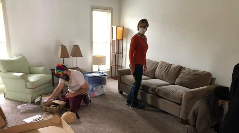 Members of the International Rescue Committee in Atlanta set up an apartment for a refugee family. Donations are needed to support the hundreds of refugees and humanitarian parolee who are expected to arrive in Atlanta over the next few months.  (Courtesy photo)