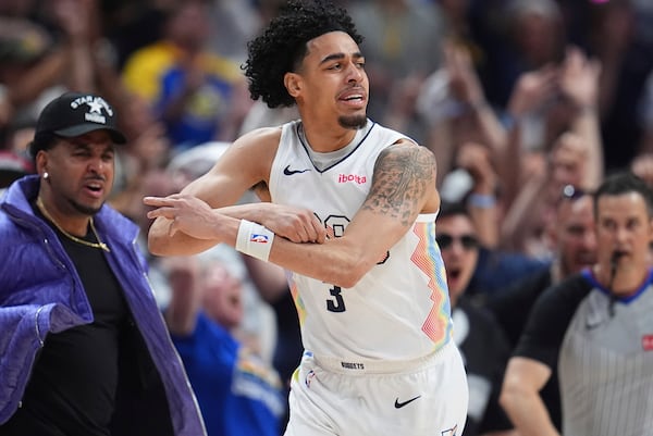 Denver Nuggets guard Julian Strawther gestures after hitting a 3-point basket against the Oklahoma City Thunder in the second half of Game 6 in the Western Conference semifinals of the NBA basketball playoffs Thursday, May 15, 2025, in Denver. (AP Photo/David Zalubowski)