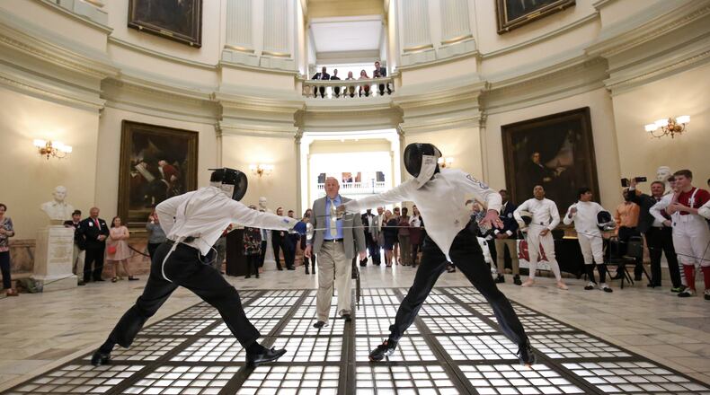 February 22, 2018 - Atlanta, Ga: Senator William T. Ligon, R - Brunswick, left, and Rep. Tom Taylor, R - Dunwoody, right, fence against each other during the Dual Under the Dome by the Georgia High School Fencing League in the Capitol Rotunda during Legislative day 25 at the Georgia State Capitol Thursday, February 22, 2018, in Atlanta. PHOTO / JASON GETZ