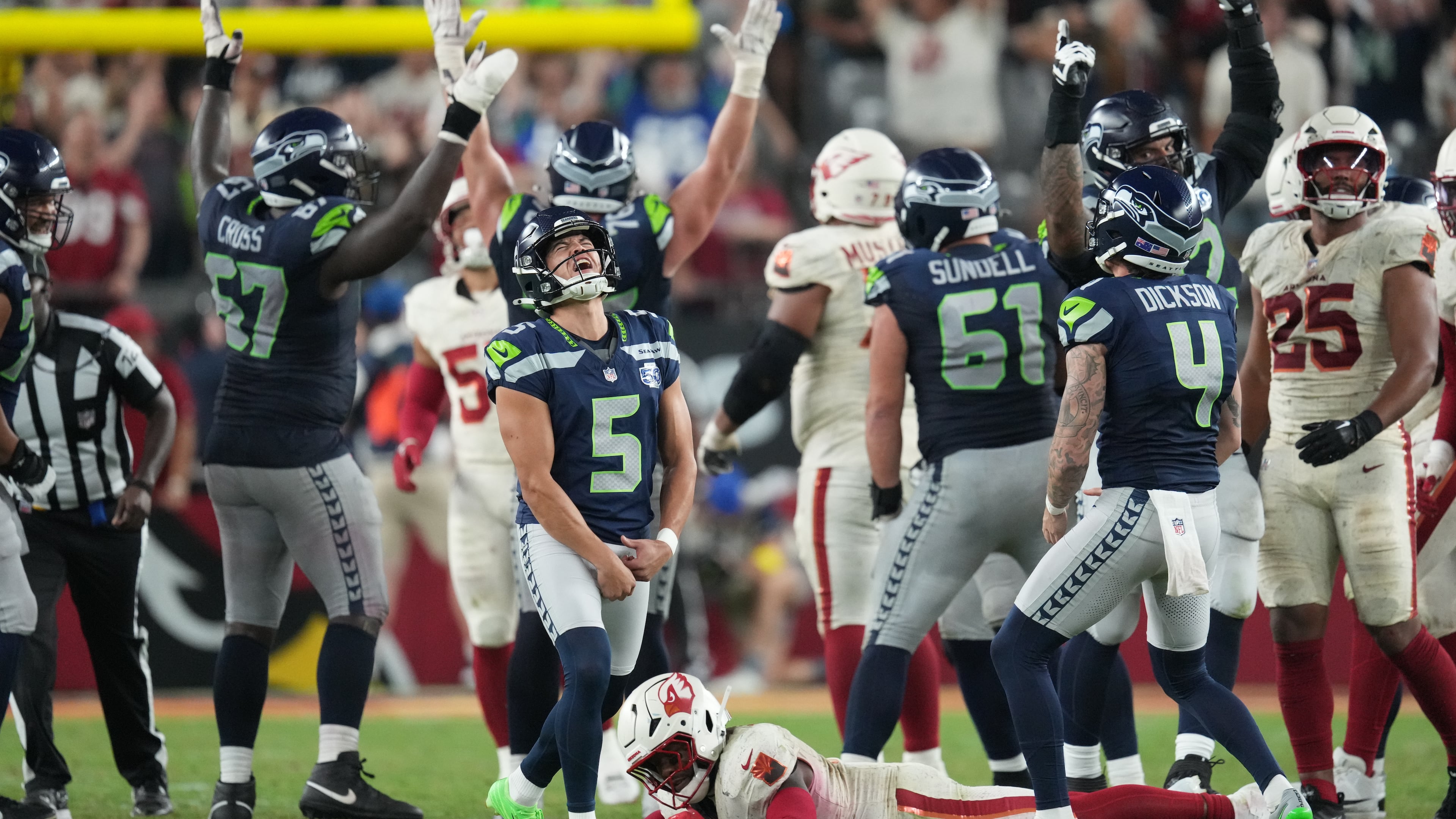 Seattle Seahawks kicker Jason Myers (5) celebrates after making a 52-yard field goal as time expires during the second half of an NFL football game Thursday, Sept. 25, 2025, in Glendale, Ariz. (AP Photo/Ross D. Franklin)