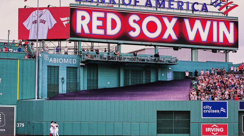 Boston Red Sox outfielders celebrate after defeating the Baltimore Orioles in the first baseball game of a doubleheader, Wednesday, July 22, 2026, in Boston. (AP Photo/Charles Krupa)