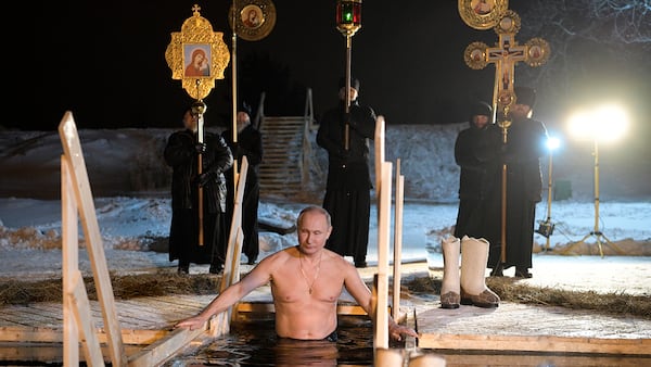 Russian President Vladimir Putin bathes in an ice-cold water on Epiphany neat St. Nilus Stolobensky Monastery on Lake Seliger in Svetlitsa village, Russia, Friday, Jan. 19, 2018. Thousands of Russian Orthodox Church followers will plunge into icy rivers and ponds across the country to mark Epiphany, cleansing themselves with water deemed holy for the day. (Alexei Druzhinin, Sputnik, Kremlin Pool Photo via AP)