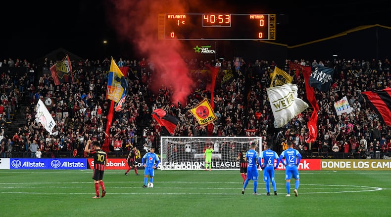 Fans celebrate and the scoreboard reflects the score going into half time during the first half of soccer in the Scotiabank Concacaf Champions League against Motagua FC, Tuesday, Feb. 25, 2020, in Kennesaw, Ga. (John Amis, Atlanta Journal Constitution)