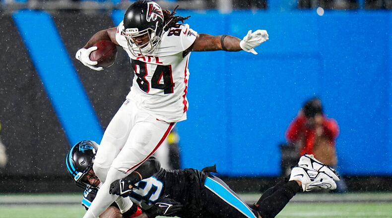 Atlanta Falcons running back Cordarrelle Patterson is tackled by Carolina Panthers linebacker Frankie Luvu during the second half of an NFL football game on Thursday, Nov. 10, 2022, in Charlotte, N.C. (AP Photo/Rusty Jones)