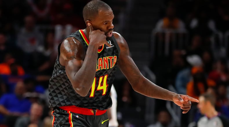 Atlanta Hawks center Dewayne Dedmon (14) reacts after scoring in the second half of an NBA basketball game against the New York Knicks on Sunday, Feb. 9, 2020, in Atlanta. (AP Photo/Todd Kirkland)