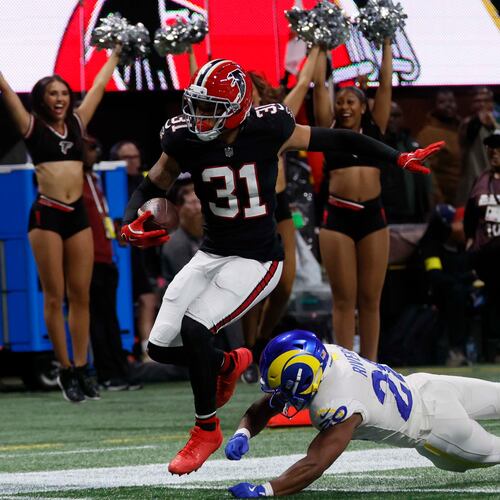 Atlanta Falcons safety Xavier Watts (31) scores a touchdown after an interception but is ruled out of bounds in the second half of an NFL football game against the Los Angeles Rams at Mercedes-Benz Stadium in Atlanta on Monday, Dec. 29, 2025. (Miguel Martinez/ AJC)
