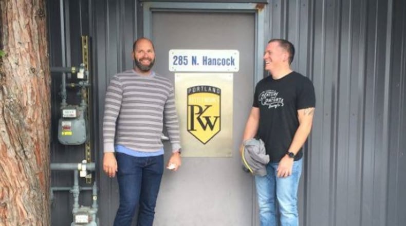 Marty Mazzawi, left, and John Reynolds during a visit to Portland, where the equipment was made for the brewery they’re bringing to Lawrenceville. (Special photo)
