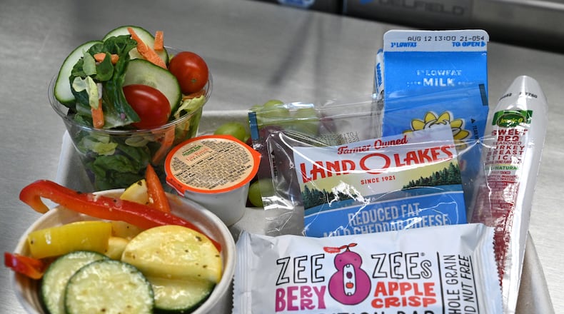 A mix of prepared breakfast items and vegetables served at lunch are displayed at Seckinger High School in Gwinnett County on Tuesday, Aug. 2, 2022. (Hyosub Shin / Hyosub.Shin@ajc.com)