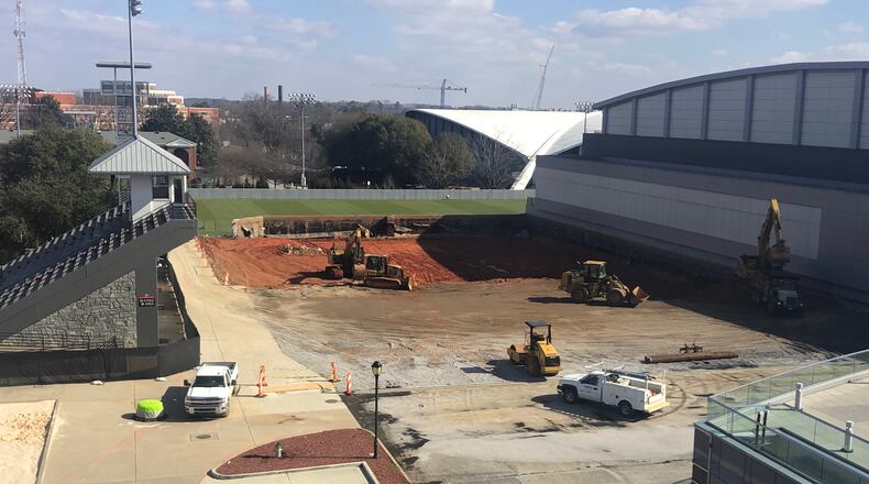 Excavators begin the process of digging down in the area of Georgia's Woodruff Practice Fields where a new $80 million football operations will be built over the next year. (Photo by Chip Towers/ctowers@ajc.com)