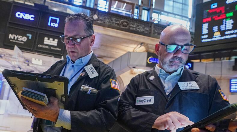 Traders Edward Curran, left, and Fred Demarco work on the floor of the New York Stock Exchange, Wednesday, June 3, 2026. (AP Photo/Richard Drew)