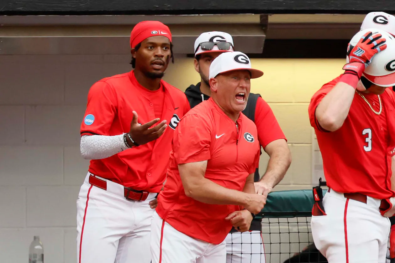 Georgia Bulldogs head coach Wes Johnson, center, reacts after his player, Georgia Bulldogs infielder Tre Phelps (1), was ejected for excessive celebration during the sixth inning of their NCAA Regional final game at Foley Field on Sunday, May 31, 2026, in Athens. Coach Johnson was also ejected.(Miguel Martinez/AJC)