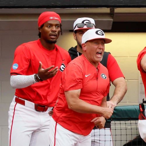 Georgia Bulldogs head coach Wes Johnson, center, reacts after his player, Georgia Bulldogs infielder Tre Phelps (1), was ejected for excessive celebration during the sixth inning of their NCAA Regional final game at Foley Field on Sunday, May 31, 2026, in Athens. Coach Johnson was also ejected.(Miguel Martinez/AJC)