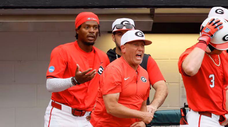 Georgia Bulldogs head coach Wes Johnson, center, reacts after his player, Georgia Bulldogs infielder Tre Phelps (1), was ejected for excessive celebration during the sixth inning of their NCAA Regional final game at Foley Field on Sunday, May 31, 2026, in Athens. Coach Johnson was also ejected.(Miguel Martinez/AJC)